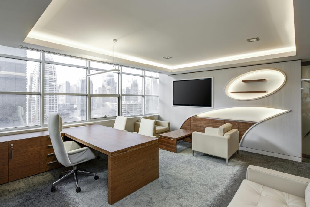 office-sitting-room-executive-sitting-37347 Gray Office Rolling Chair Near Brown Wooden Desk in Front of Flat Screen Tv on White Painted Wall
